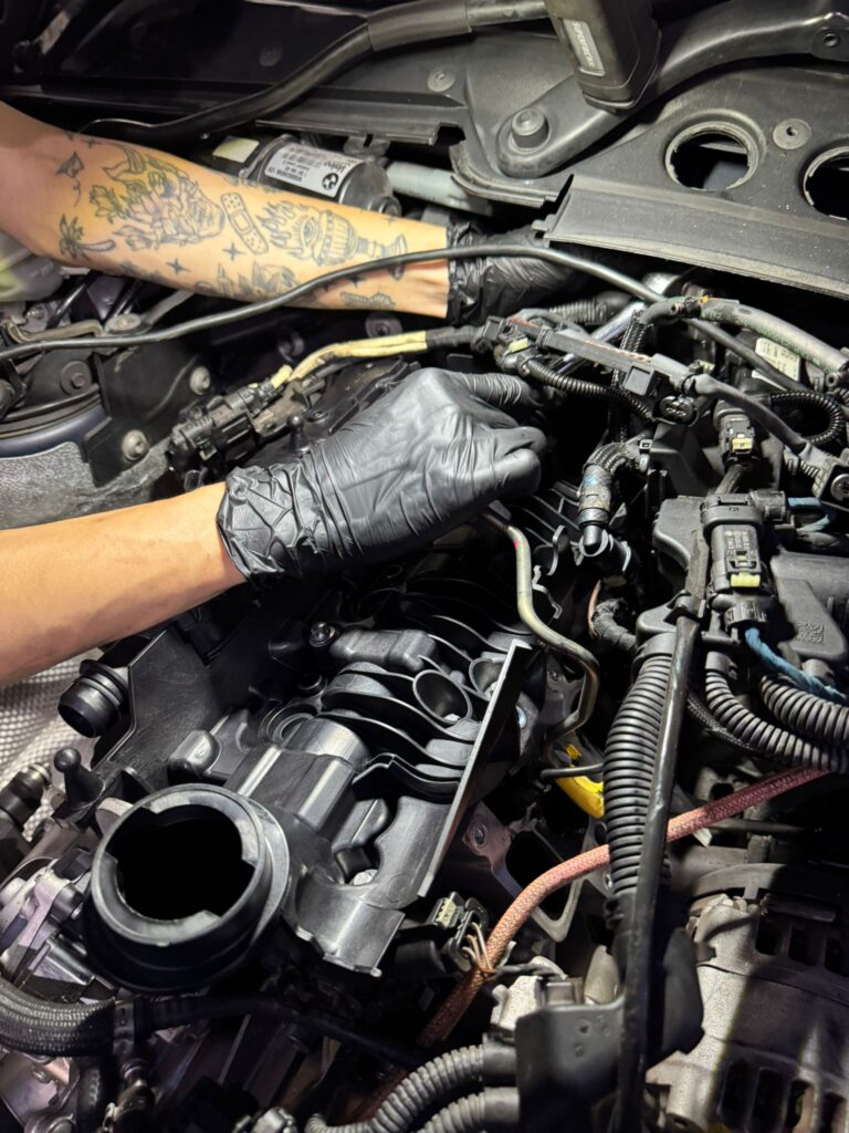 TEC AUTO technician working on BMW intake manifold in Woodlands Singapore workshop