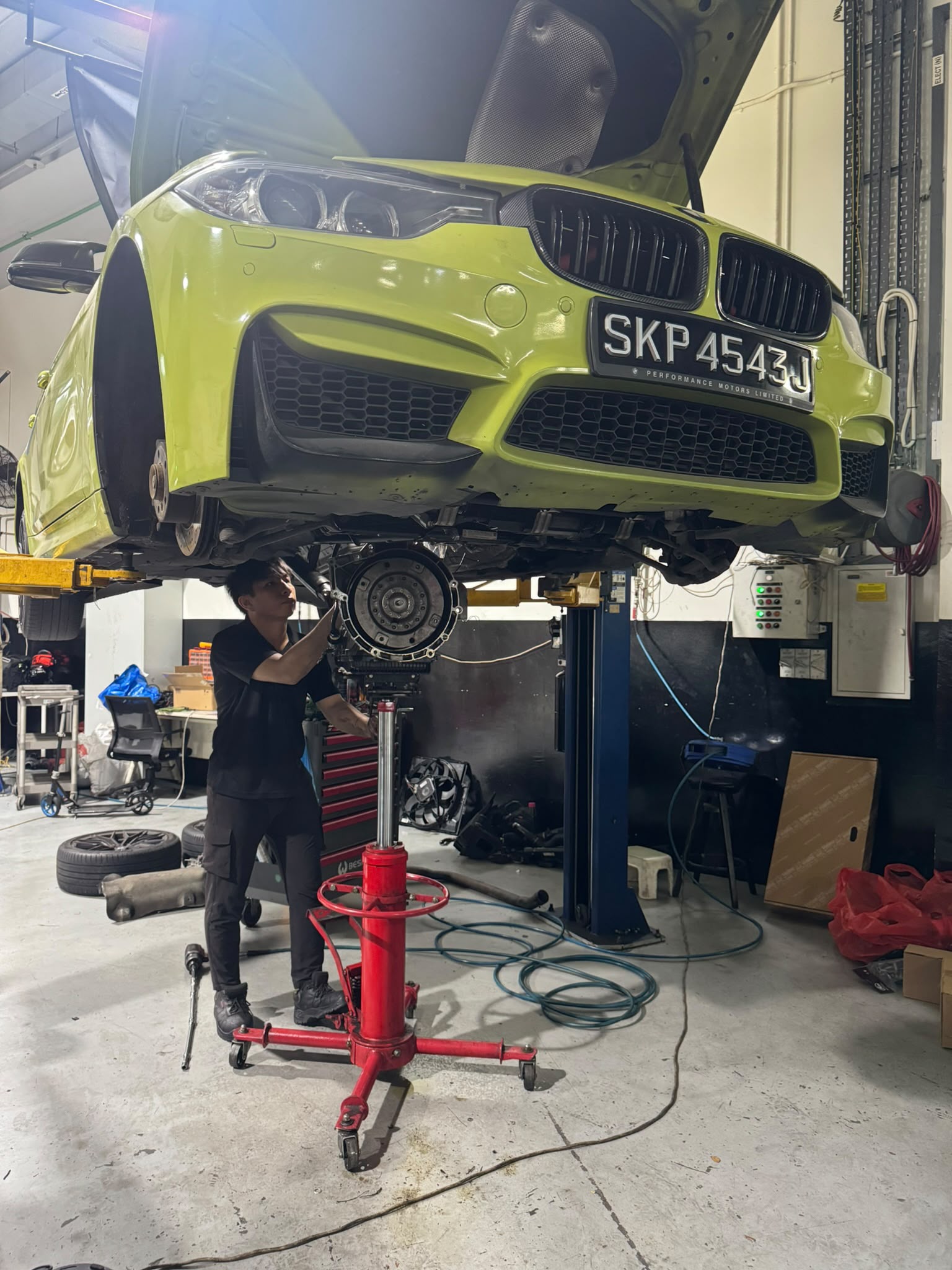BMW on a workshop lift at TEC AUTO Services Singapore