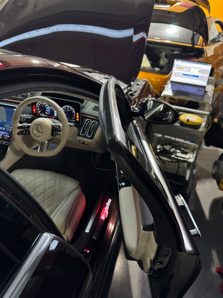 Mercedes-Benz S400 interior during headlamp coding with diagnostic laptop connected, TEC AUTO Singapore