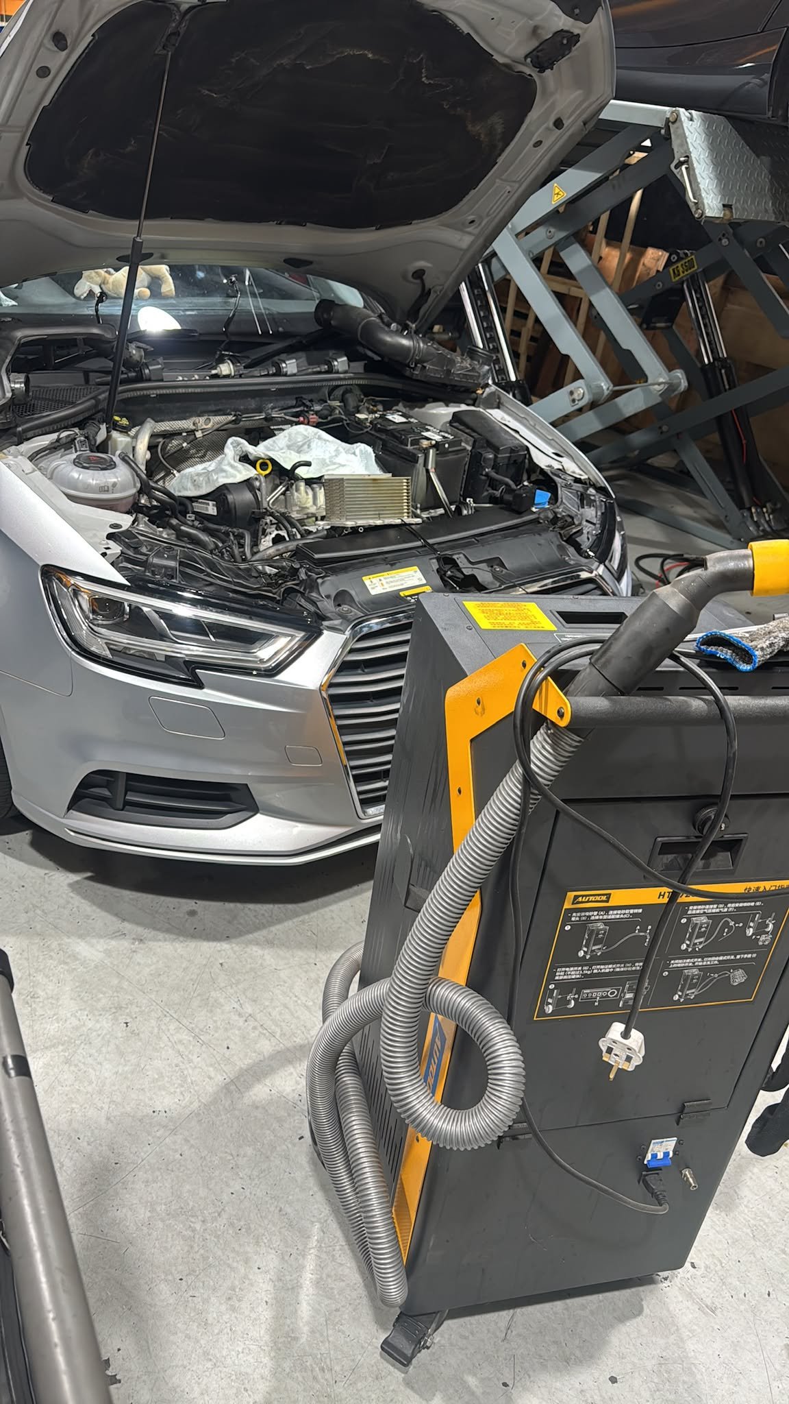 Audi A3 intake carbon cleaning Carbon cleaning machine connected to an Audi A3 engine at a Singapore workshop